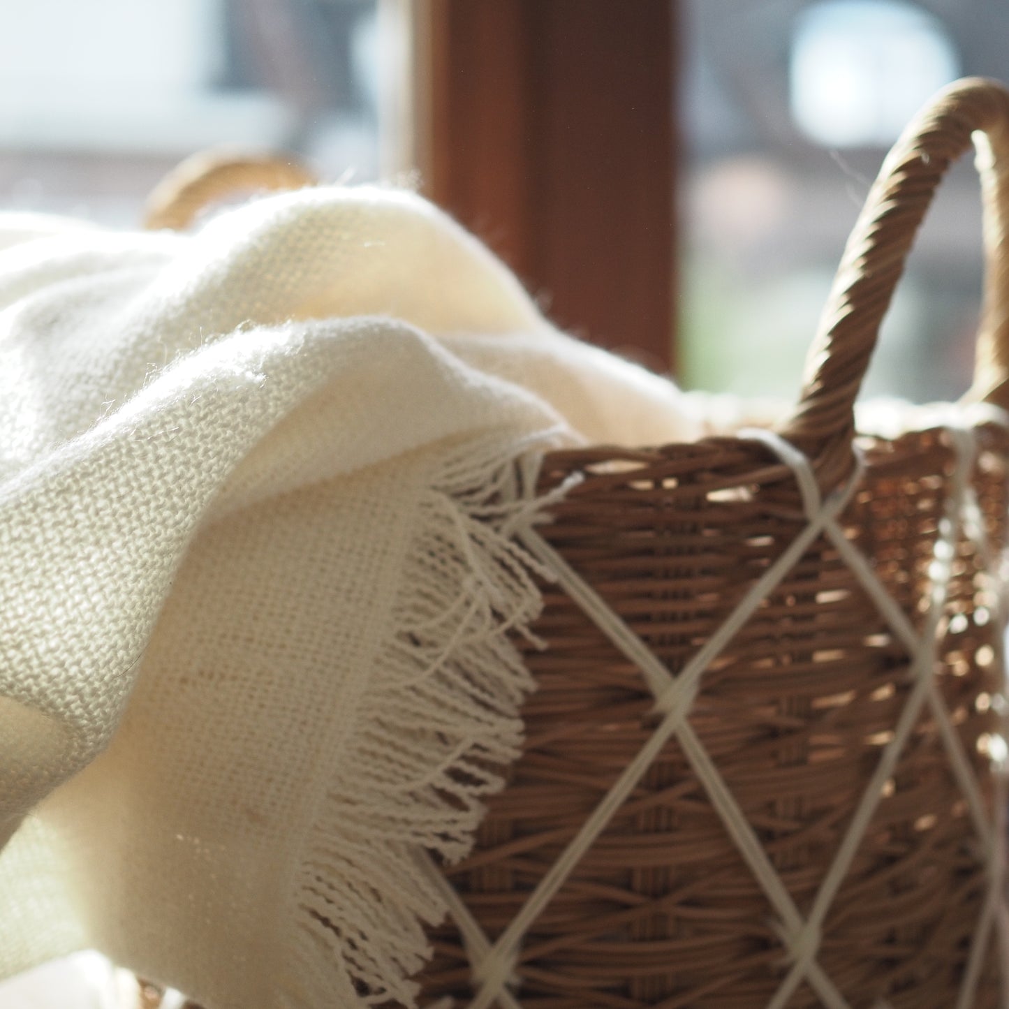 Rattan basket with white macrame