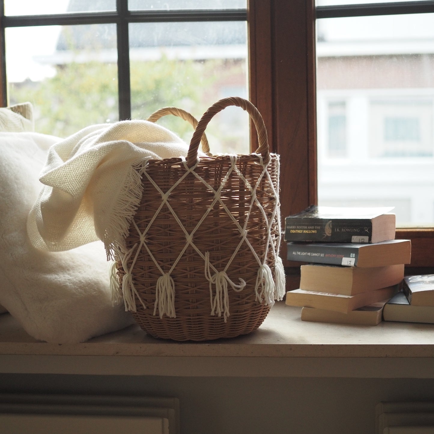 Rattan basket with white macrame